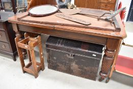 A 19th Century mahogany wind out dining table in the Gillows style, having heavy turned and fluted