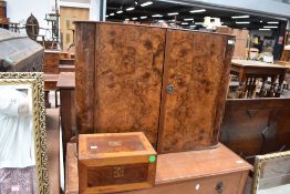 An interesting mid 20th Century walnut wall cabinet, handwritten label inside for Robinsons,