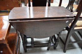 A mid 20th Century dark oak gateleg occasional table, width approx. 67cm