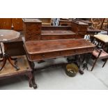 A Victorian mahogany desk or dressing table having turned stretcher and scroll legs, large