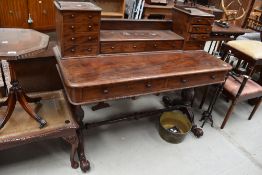 A Victorian mahogany desk or dressing table having turned stretcher and scroll legs, large