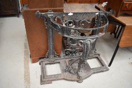 A C19th cast iron Coalbrookdale style frame hall stand, having cabriole front support and paw foot