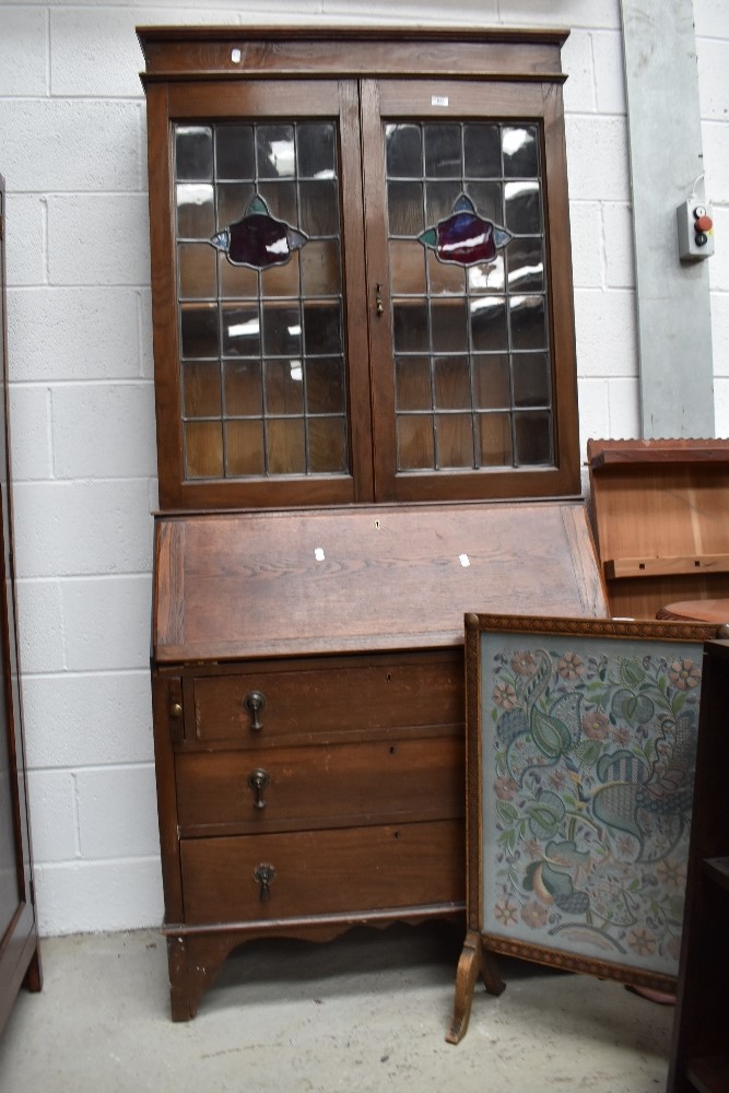 A late 19th or early 20th Century oak bureau bookcase