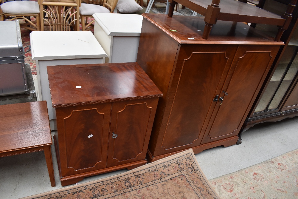 A modern reproduction media cabinet and smaller matching cupboard with vinyl records included