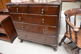 An early 20th Century oak bedroom chest of two over three drawers