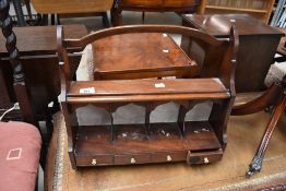 A 19th Century mahogany wall shelf with stationery compartments, width approx. 42cm