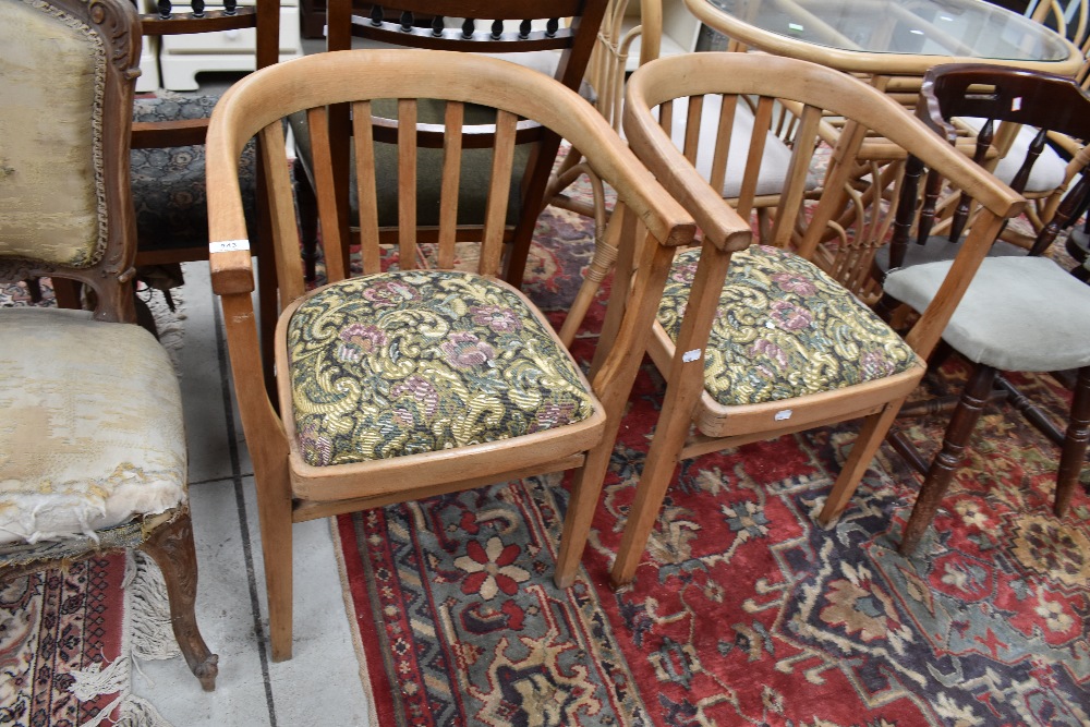 A pair of vintage bow back carver chairs