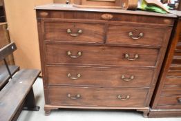 A 19th Century mahogany chest of two short over three long drawers having inlaid decoration