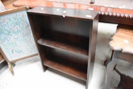 An early 20th Century dark oak low bookshelf, width approx. 60cm