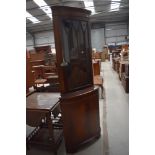 A reproduction Regency mahogany corner display cabinet