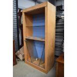 A modern beech display unit, suitable for a shop or a large private collection, glazed doors and