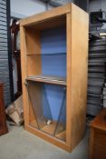 A modern beech display unit, suitable for a shop or a large private collection, glazed doors and