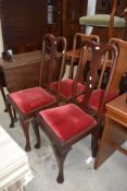 A harlequin set (two plus two) early 20th Century Queen Anne style mahogany vase back dining chairs