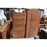 A 1930s limed oak compact bedroom suite comprising , single wardrobe, bed frame, chest of drawers