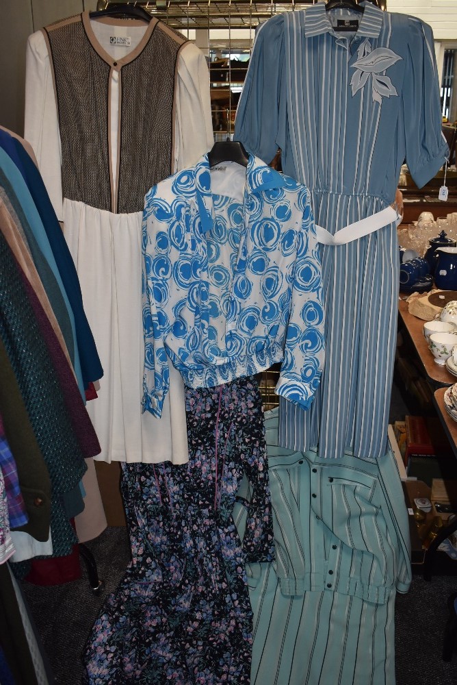 A mixed lot of ladies retro clothing including skirt sets and dresses.