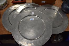 Four large vintage pewter dinner plates, possibly French.