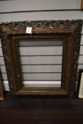 An impressive antique gilt and gesso carved picture or mirror frame inner measuring 41cm x 52cm