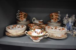 A part tea service in a gilt and Imari design stamped PR to base Prussia