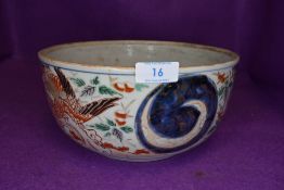 An antique Chinese porcelain fruit of similar punch bowl decorated with phoenix and moon landscape