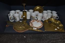 A good selection of royal coronation mugs and fire side brass ware items