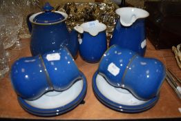 A selection of Denby in blue colour way including tea pot, cups and saucers and jugs.