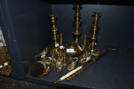 A selection of brass wares including two pairs of candle sticks and miniature versions also