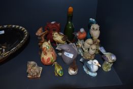 A selection of various bird and owl figures including wooden porcelain and resin