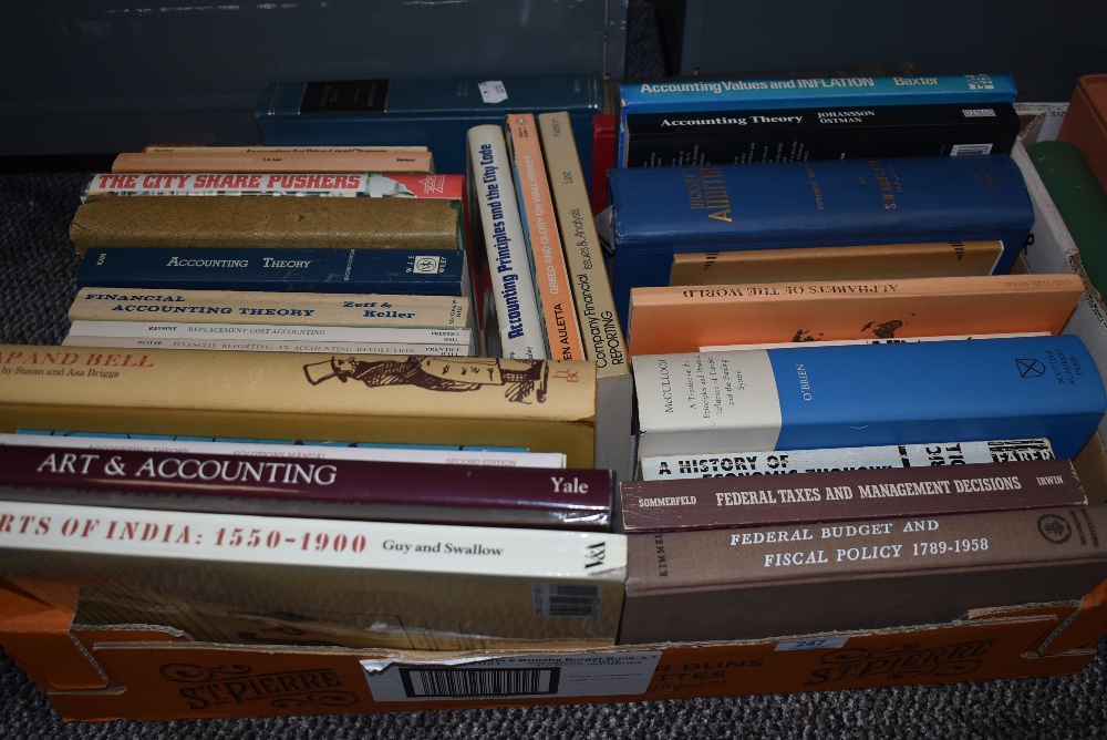 A box of text and reference books for tax banking and economic theory