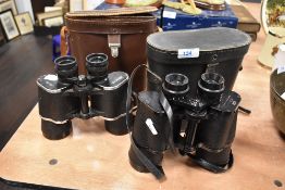 Two pairs of binoculars including Bosche 10x50 and Regent 10x50 both with case