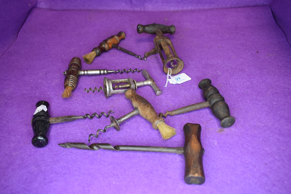 Seven bottle openers or cork screws including antique etc
