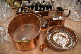 A selection of copper wares including small watering can marked Haws a fish steamer and miniature