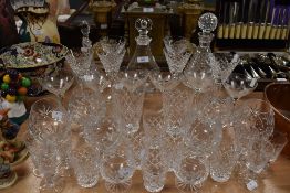 A selection of fine glass wares including six Waterford wine glasses having cut stems, and similar