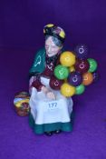 A figure study by Royal Doulton 'the old balloon seller' on green back stamp