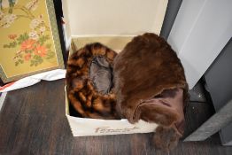 Two hats, one mink and a similar fur stole and blanket.