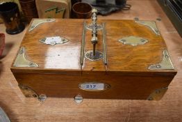 A vintage oak caddy or box having two lidded compartments with handle to centre.