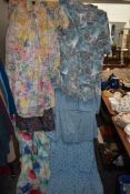 A mixed lot of ladies retro clothing skirt sets, bright patterns and colours throughout.