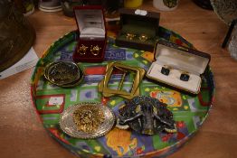 Four belt buckles including native Indian designs and three sets of cuff links