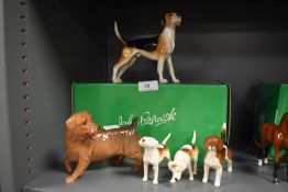 Five figure studies by Beswick including three Fox hound Norfolk terrier and similar hound with box