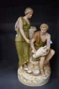 A figure study of two potters by Royal Dux 45cm tall