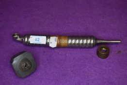 An antique Chinese opium smokers pipe with bamboo shaft and heavy set metal fitments and cast