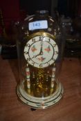 A glass domed anniversary clock by Kundo West Germany