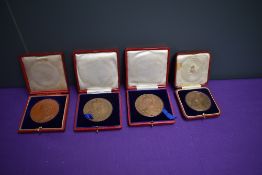 Four cased Medallions, Diamond Jubilee Queen Victoria 1837-1937, young head and jubilee head, 1902