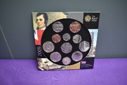 A UK 2009 Brilliant Uncirculated Coin Collection, 11 coins including Kew Garden 50P