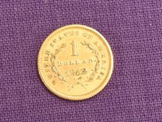 A USA Gold 1852 Liberty Head One Dollar Coin