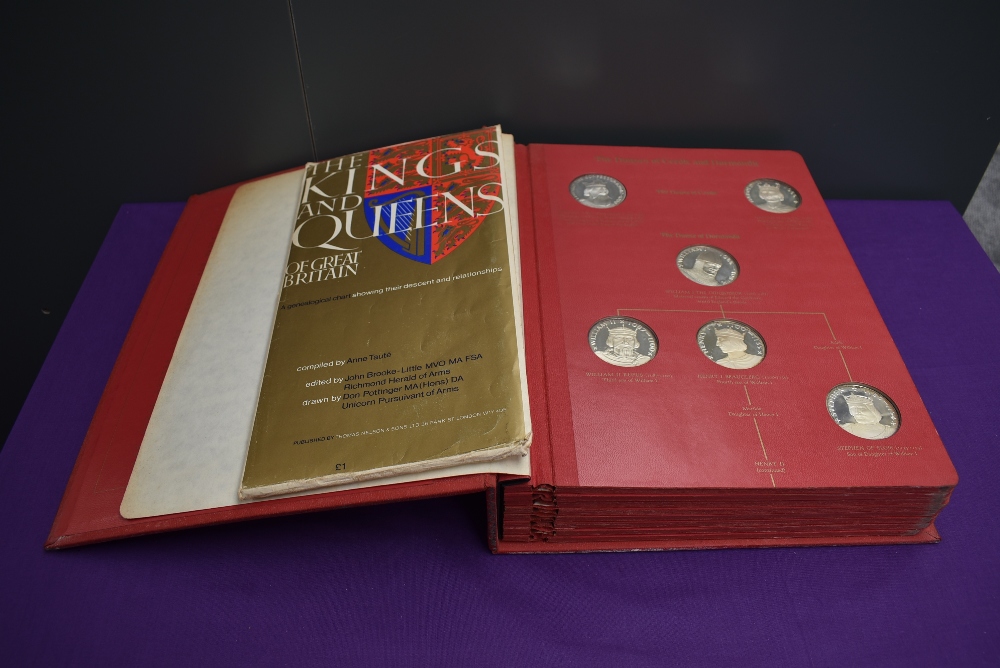 An album of The Kings and Queens of England, First Edition Sterling Silver Proof Set Medallions,