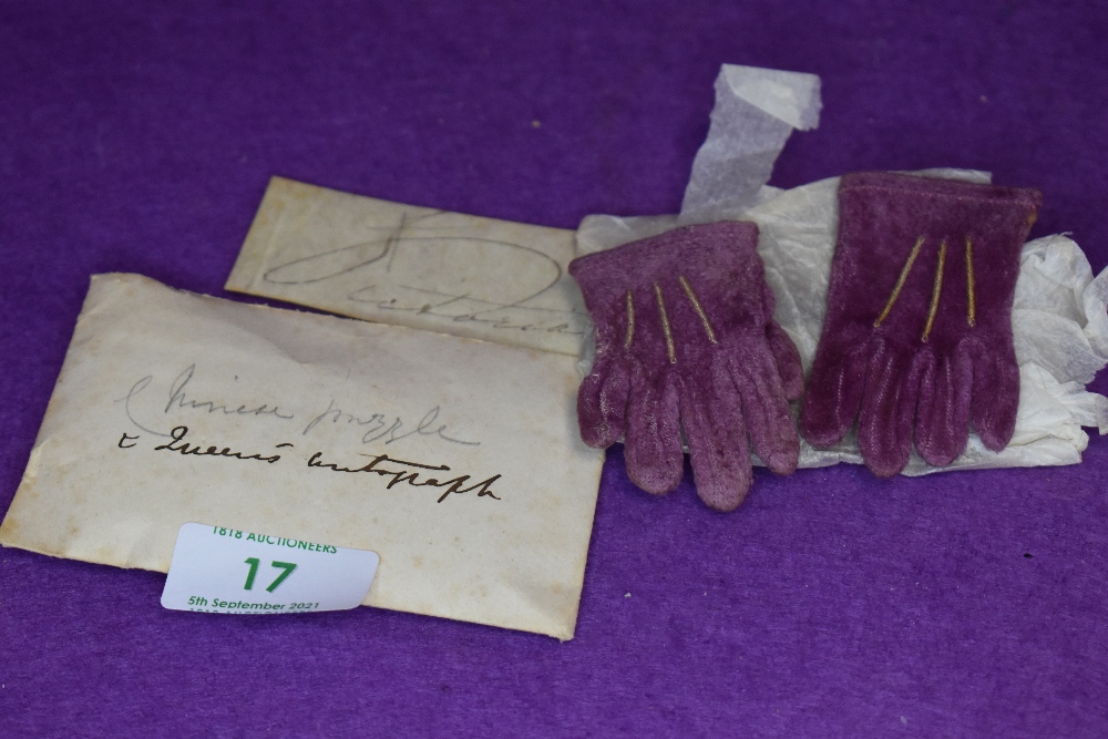 A pair of dolls gloves having belonged to Queen Victoria accompanied with a signature on vellum