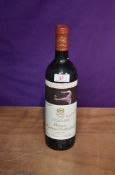 A bottle of Chateau Mouton Rothschild 1990 Pauillac, Classe Premier Cru 12.5% vol 75cl, label homage