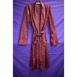 A gents 1960s Tootal dressing gown in red.