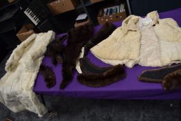 A box of vintage furs for make do and mend or repair including an ermine cape having Harrods label.