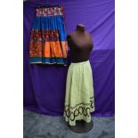 An early 20th century lime green skirt with embroidered detailing and bright vintage ethnic skirt.